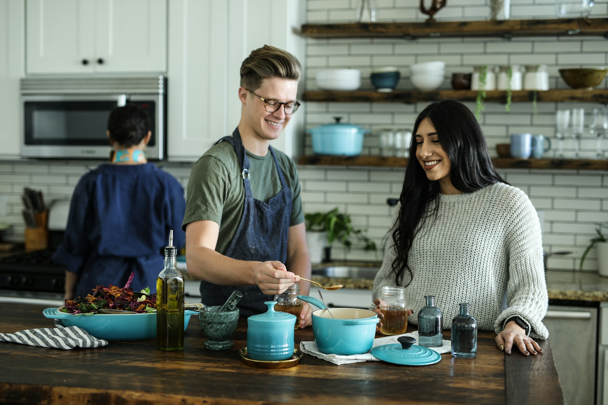 Chef standing with arms crossed in a professional kitchen